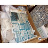 Box containing assorted vintage and antique lace with related book