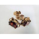 A pair of 9 carat gold garnet solitaire stud earrings - This lot MUST be paid for and collected,