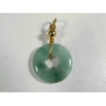 A jade and unmarked 9 carat gold pendant - This lot MUST be paid for and collected,