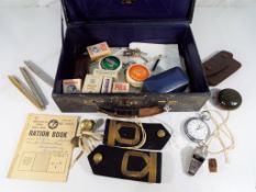 A vintage case containing Royal Navy epaulettes and buttons by The Tailors of Gieves Ltd,