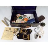 A vintage case containing Royal Navy epaulettes and buttons by The Tailors of Gieves Ltd,