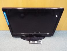 A Sanyo HD Ready 32"television with remote control, model No. CE32LD90-B.