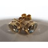 A pair of 9 carat gold and topaz solitaire stud earrings - This lot MUST be paid for and collected,