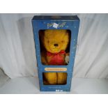 A large Deans Childsplay teddy bear in original box, approximately 60 cm (h).