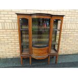 A good quality bow fronted display cabinet with detailed inlay,