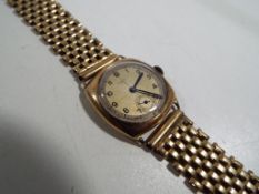 Rotary - a gentleman's wristwatch and bracelet, the watch case of yellow metal and marked 12543,