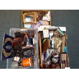 Three boxes containing a mixed lot to include plated flatware, tankards, vintage binoculars,