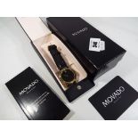 A gentleman's Museum wristwatch by Movado, plain black dial with single accent at the 12 o'clock,