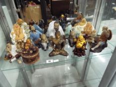 A quantity of ceramic Japanese figurines and Buddha - This lot MUST be paid for and collected,