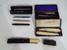 Five vintage cut-throat razors in cases,
