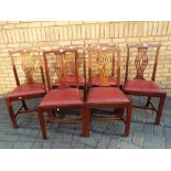 A set of six Edwardian Chippendale style dining chairs with pierced back splats and red drop-in