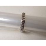 A 9 carat gold 15 point diamond set full eternity ring, approx 2.