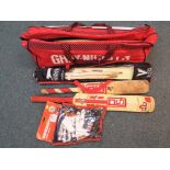 A Gray-Nicolls cricket bag containing a quantity of cricket equipment to include bats,