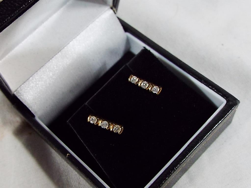 A 9 carat gold 20 point diamond trilogy pair of stud earrings, - Image 2 of 2