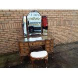 A good quality walnut veneer kidney shaped dressing-table with three piece mirror and stool,