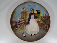 Royal Doulton - a Royal Doulton charger entitled Biddy Penny Farthing marked D6666 modelled by