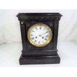 A French black marble mantel clock,