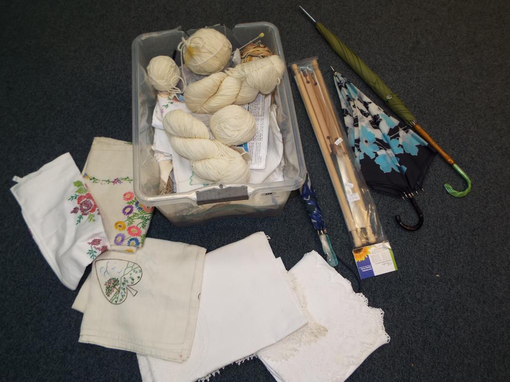 A mixed lot to include a quantity of wool, vintage linen, knitting needles,