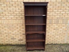 A large free standing priory linenfold fronted bookcase, approximately 187 cm x 78 cm x 29 cm.