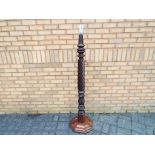 An antique mahogany twist column standard lamp, approximately 173 cm (h) with shade fitting.