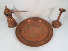 A large copper tray approximately 32 cm (d), a lidded jug and a vase.