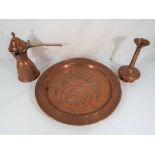 A large copper tray approximately 32 cm (d), a lidded jug and a vase.