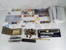 Approximately 50 sets of First Day Covers (some franked), a small quantity of UK and foreign coins,