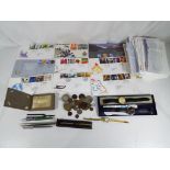 Approximately 50 sets of First Day Covers (some franked), a small quantity of UK and foreign coins,