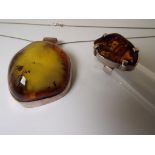 A lady's large pendant, chain and ring, each with sterling silver mounts set with amber,