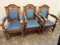 A set of three oak framed Town Hall chairs with 'Warings' maker's plaques applied to the stretchers,