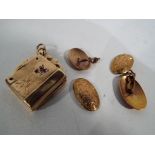 A 9 carat gold locket set with three amethysts and a pair of scrap gold 9 carat cufflinks,