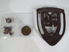A German Labour Day pin badge with swastika and eagle,
