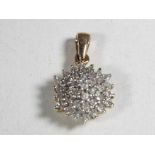 A hallmarked 9 carat gold and 0.50 carat diamond pendant.