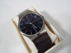 A gentleman's Obaku, Denmark, titanium cased wristwatch on a woven/ close-link titanium bracelet,