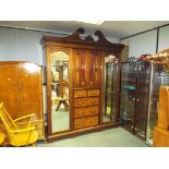 A fine quality revival break front triple wardrobe,