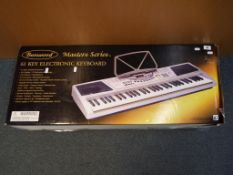 A Burswood Masters Series 61 key electronic keyboard in original box - This lot MUST be paid for