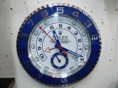A promotional wall clock advertising the Rolex brand.
