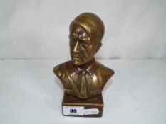 A brass bust depicting Hitler.