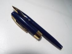 A Sheaffer fountain pen with 14 carat gold nib.