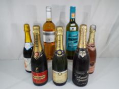 Seven bottles with contents to include Piper Heidsieck champagne,