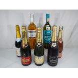 Seven bottles with contents to include Piper Heidsieck champagne,