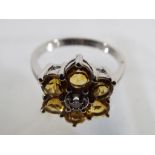 A lady's 9 carat white gold, citrine and diamond ring, size N, approx. weight 2.