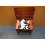 A vintage wooden inlaid sewing table with Mapsa musical movement plus contents,