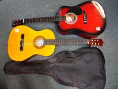 A Stagg acoustic guitar model No. SW201RDS and a Herald acoustic guitar, model No.