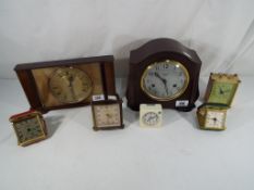 A Smiths mantel clock, Bakelite case with silvered dial, Arabic numerals,