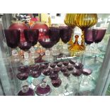 Two shelves containing approximately 35 pieces of glassware to include Cranberry glass,