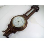 A carved oak wheel barometer / thermometer, 89 cm (high) - This lot MUST be paid for and collected,