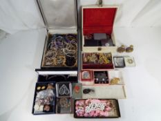A large quantity of costume jewellery and two jewellery boxes to include some stamped 925 and a