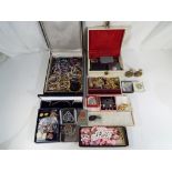 A large quantity of costume jewellery and two jewellery boxes to include some stamped 925 and a