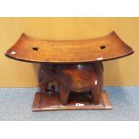 An African hardwood seat carved in the form of an elephant, approximately 51 cm x 59 cm x 19 cm .